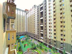 an aerial view of an apartment complex with a playground at Fancy Designed 2BR at Gateway Ahmad Yani Cicadas Apartment By Travelio in Bandung