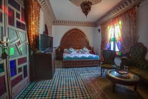 Postel nebo postele na pokoji v ubytování Riad Salam Fes