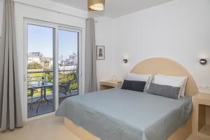 Ένα ή περισσότερα κρεβάτια σε δωμάτιο στο Gaia Rooms