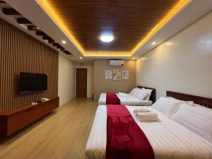 Postel nebo postele na pokoji v ubytování Summerville Hotel and Resort