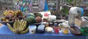 a table with a bunch of fruits and vegetables on it at Hula Hula Sunset, Dome in Pai