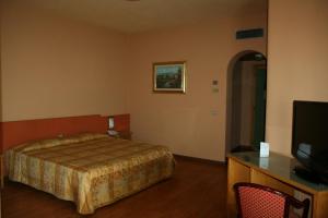 Letto o letti in una camera di Hotel Tre Torri