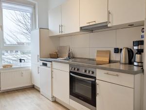 Kuchyň nebo kuchyňský kout v ubytování Förde Townhouse