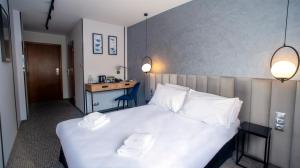 Łóżko lub łóżka w pokoju w obiekcie B&B HOTEL Piotrków Trybunalski