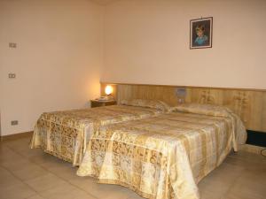 Letto o letti in una camera di Hotel Tre Torri