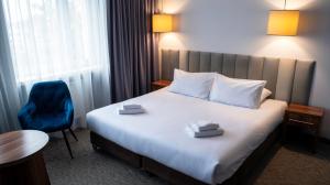 Łóżko lub łóżka w pokoju w obiekcie B&B HOTEL Piotrków Trybunalski