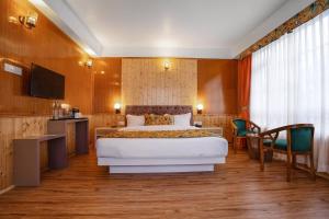 Summit Gangchen Hotel客房内的一张或多张床位