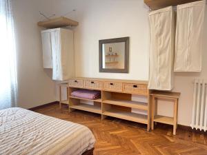 a bedroom with a bed and a dresser at 1 Min Walk from the Sea, with 2 Bed and 2 Bath in Alassio +24 photos