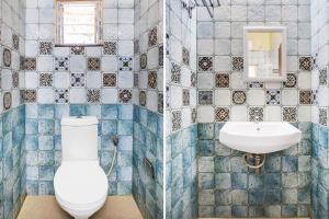 a bathroom with a toilet and a sink at Super Hotel O Lalganesh formerly Royal Avenue in Guwahati