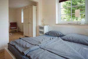 Postel nebo postele na pokoji v ubytování 2-Zimmer Ferienwohnung "Zimmert"