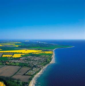 an aerial view of an island in the ocean at Kapitänshaus in Waabs +6 photos