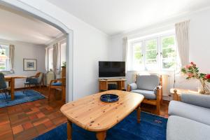 a living room with a table and a couch at Gmelinstrasse 33 in Wyk auf Föhr