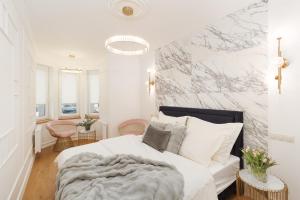 Postel nebo postele na pokoji v ubytování BICE apartments & Wellness