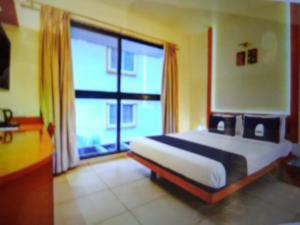 Ένα ή περισσότερα κρεβάτια σε δωμάτιο στο Astra Hotels & Suites - Marathahalli SG
