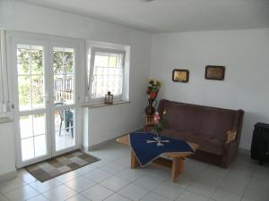 a living room with a couch and a table at Ferienhaus Nr1 in Balatonszárszó