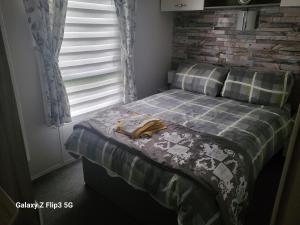 Voodi või voodid majutusasutuse MLR at Craig Tara Bay View toas