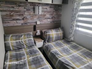 Voodi või voodid majutusasutuse MLR at Craig Tara Bay View toas