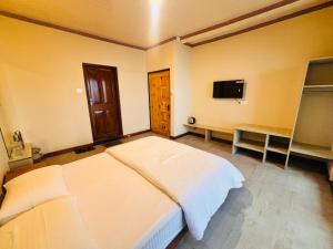 Postel nebo postele na pokoji v ubytování Asraya Homestay