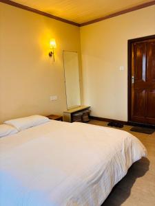 Postel nebo postele na pokoji v ubytování Asraya Homestay