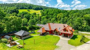 an aerial view of a house with a gazebo at Siedlisko Leszczyny in Kunkowa