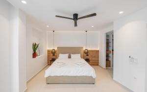 Ένα ή περισσότερα κρεβάτια σε δωμάτιο στο Elia Cove Luxury Villas & Residences