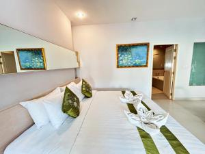 Postel nebo postele na pokoji v ubytování Khuang Singh Residence & Hotel Chiangmai