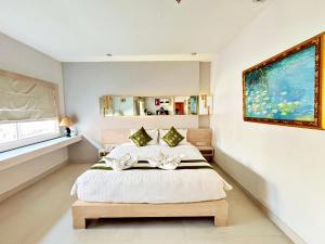 Postel nebo postele na pokoji v ubytování Khuang Singh Residence & Hotel Chiangmai