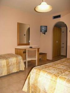 Letto o letti in una camera di Hotel Tre Torri