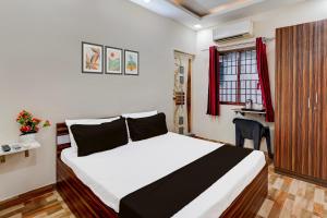 Postel nebo postele na pokoji v ubytování Super Hotel O Choolai Near Chennai Railway Station