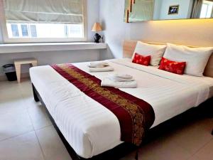Postel nebo postele na pokoji v ubytování Khuang Singh Residence & Hotel Chiangmai