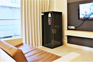 TV a/nebo společenská místnost v ubytování Khuang Singh Residence & Hotel Chiangmai