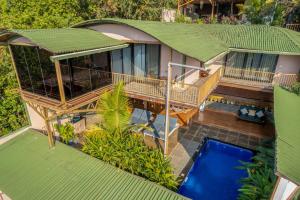 an overhead view of a house with a swimming pool at Simroseate in Agonda