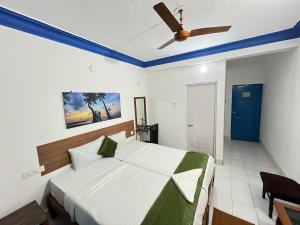 Dom Pedros Haven Resort - Tranquil Retreat by the Sea客房内的一张或多张床位