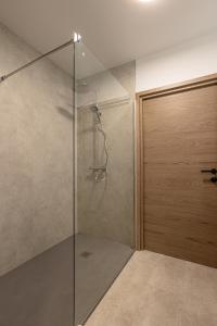 a shower with a glass door in a bathroom at Le Dauphiné 2 - Allevard in Allevard +25 photos