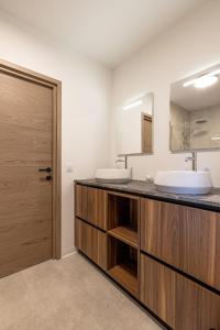a bathroom with two sinks and a mirror at Le Dauphiné 2 - Allevard in Allevard