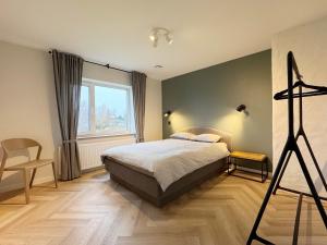 Postel nebo postele na pokoji v ubytování Ipu Puhkemaja - Riverside Holiday Home + 15 fotografií