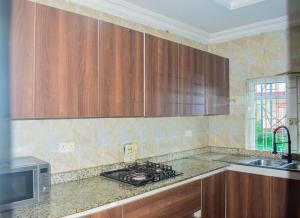 Kuchyň nebo kuchyňský kout v ubytování Cozy apartment en-suite