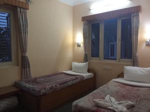 Katil atau katil-katil dalam bilik di Hotel Celestyinn