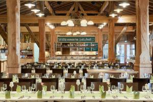 a dining room with tables and chairs in a building at Hotel Gasthof Klause Dependance 2 in Reutte