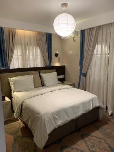 Postel nebo postele na pokoji v ubytování Centurion Aparthotel