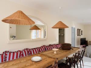 a living room with a table and a couch at Le Cottage du Lignon - Lumineuse Elégante Calme WiFi in Le Chambon-sur-Lignon