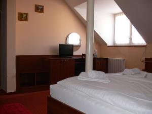 Postel nebo postele na pokoji v ubytování Penzion Oaza