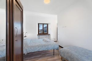 Postel nebo postele na pokoji v ubytování Casa Vacanza da Zia Piera