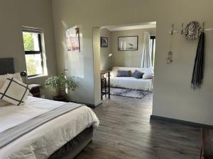Ένα ή περισσότερα κρεβάτια σε δωμάτιο στο Cozy Nook in Noordhoek