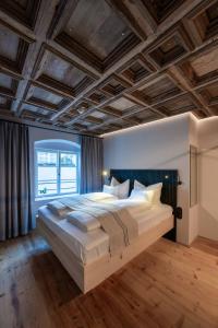 Postel nebo postele na pokoji v ubytování Hotel Kühbacher