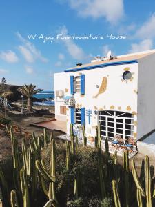 a house with a cactus in front of it at Ajuy Fuerteventura House in Ajuy