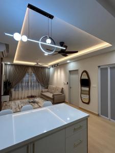 a living room with a table and a couch at Julia HavenStay, Sepang KLIA in Sepang +29 photos