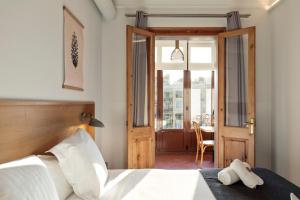 Postel nebo postele na pokoji v ubytování Central Apartments Barcelona