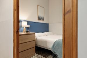Posteľ alebo postele v izbe v ubytovaní Central Apartments Barcelona