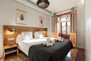 Posteľ alebo postele v izbe v ubytovaní Central Apartments Barcelona